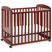 DaVinci Alpha Mini Rocking Wood Baby Crib in Cherry