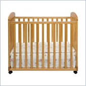 DaVinci Alpha Mini Rocking Mobile Wood Baby Crib in Honey Oak