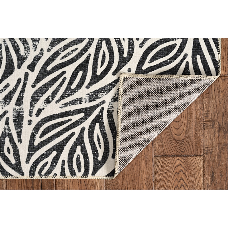 Linon Washable Kai Polyester 2'x8' Rug in Ivory and Black