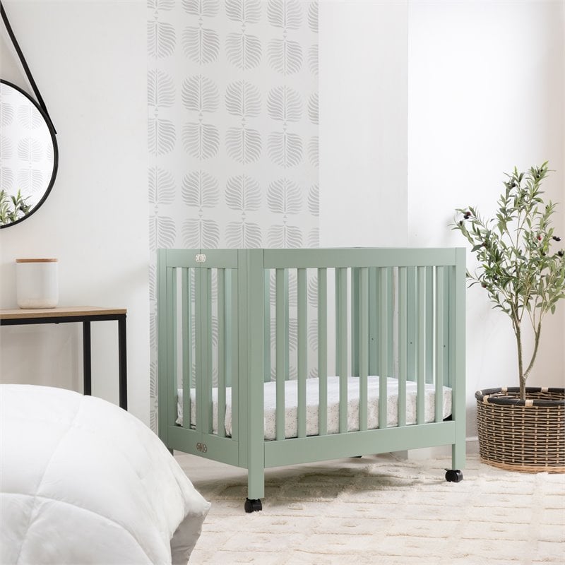 Babyletto Origami Pine Wood Portable Folding Mini Crib with Casters - Light Sage