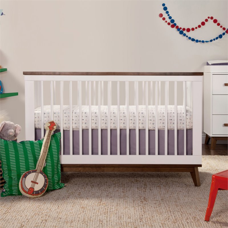 white wooden cot bed with mattress