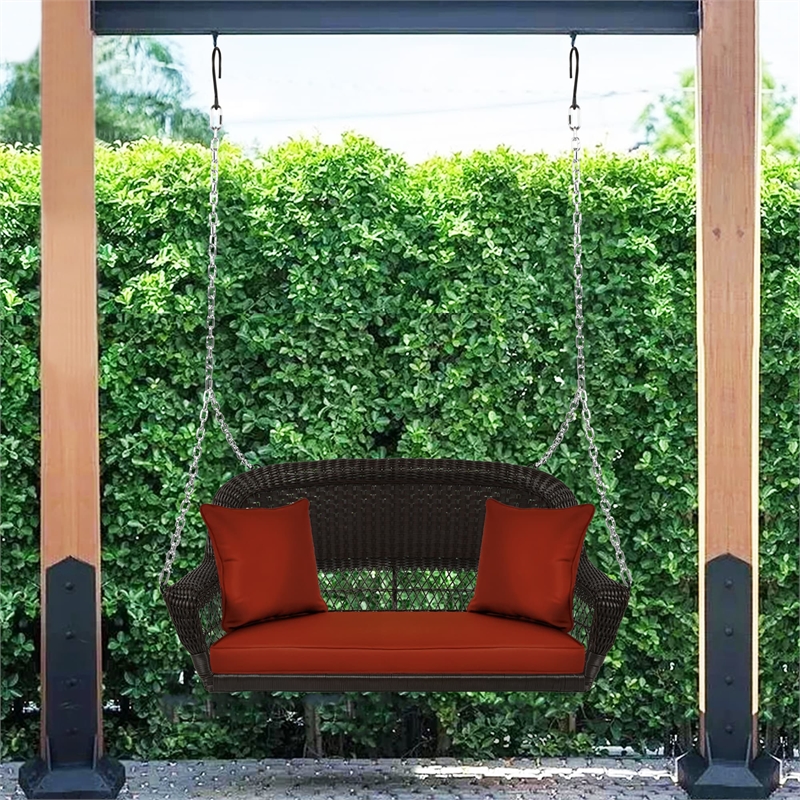 Jeco Wicker Porch Swing in Espresso with Red Cushion