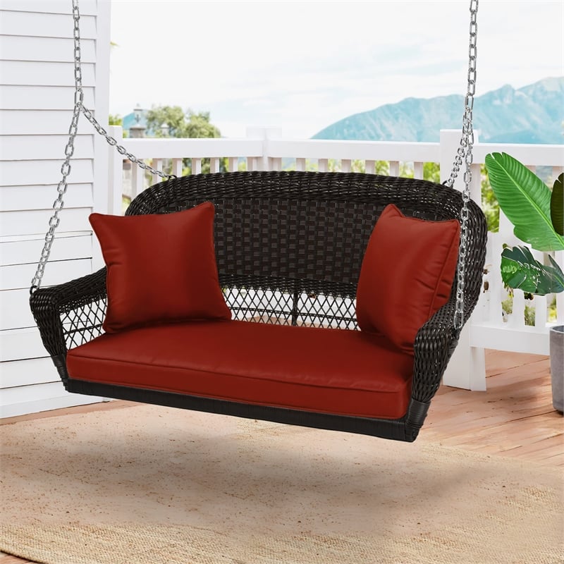 Jeco Wicker Porch Swing in Espresso with Red Cushion