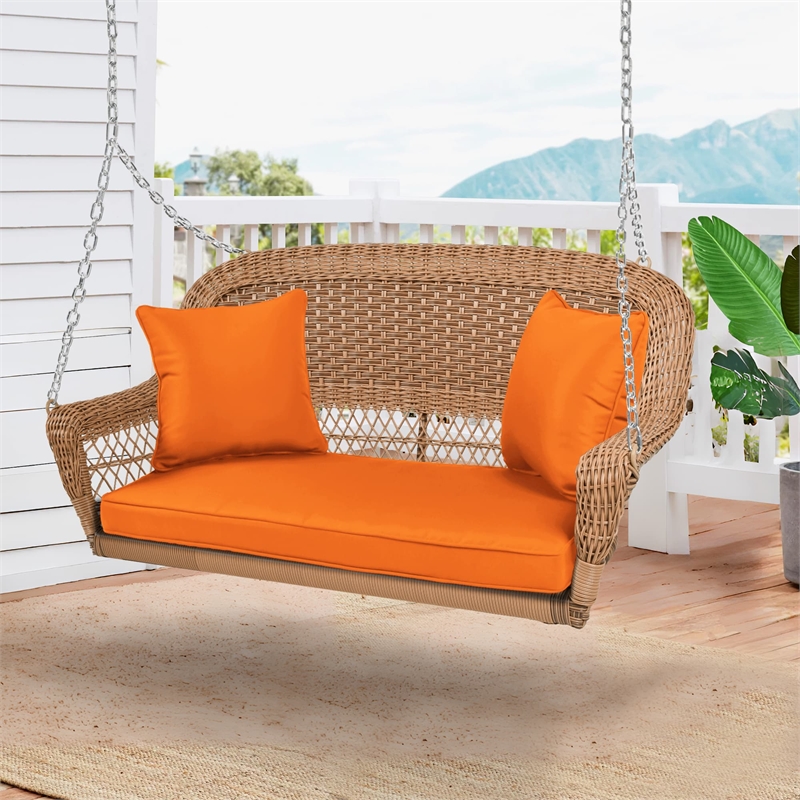 Jeco Honey Resin Wicker Hanging Porch Swing with Cushion in Orange