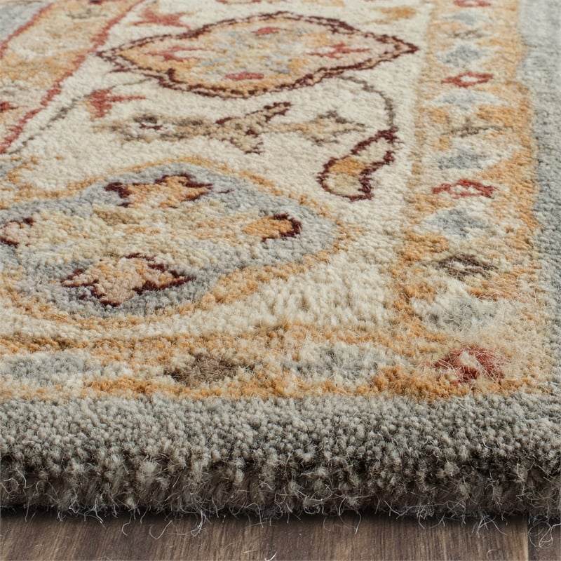 Safavieh Antiquity 5' X 8' Hand Tufted Wool Rug in Blue and Ivory