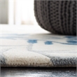 Safavieh Capri 5' X 8' Hand Tufted Wool Pile Rug in Ivory and Blue