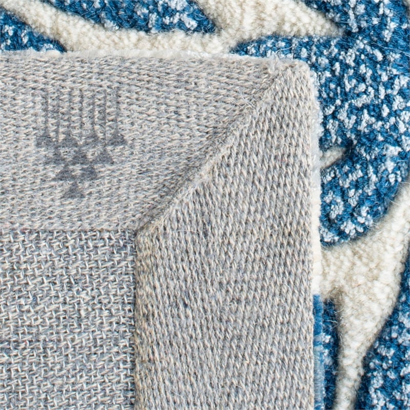 Safavieh Capri 5' X 8' Hand Tufted Wool Pile Rug in Ivory and Blue