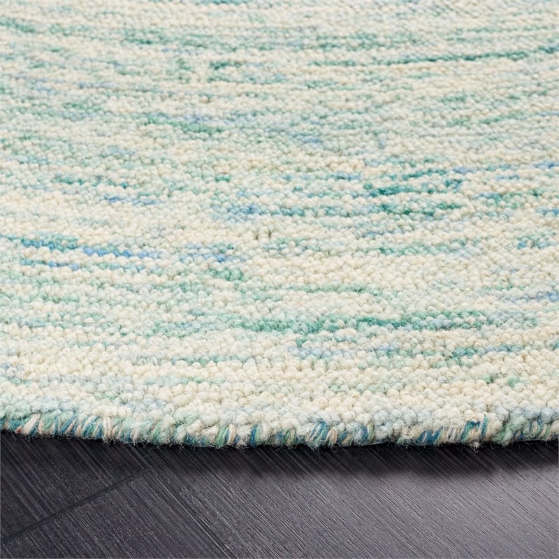 Safavieh Ikat 4' Round Hand Tufted Wool Rug in Ivory and Blue
