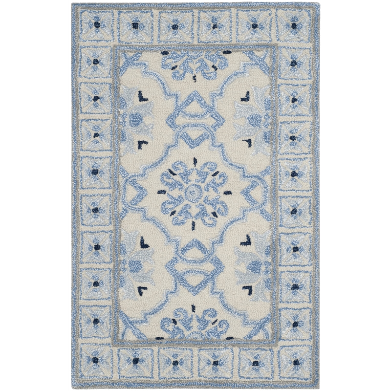 Safavieh Bella 6' X 9' Hand Tufted Rug in Ivory and Blue