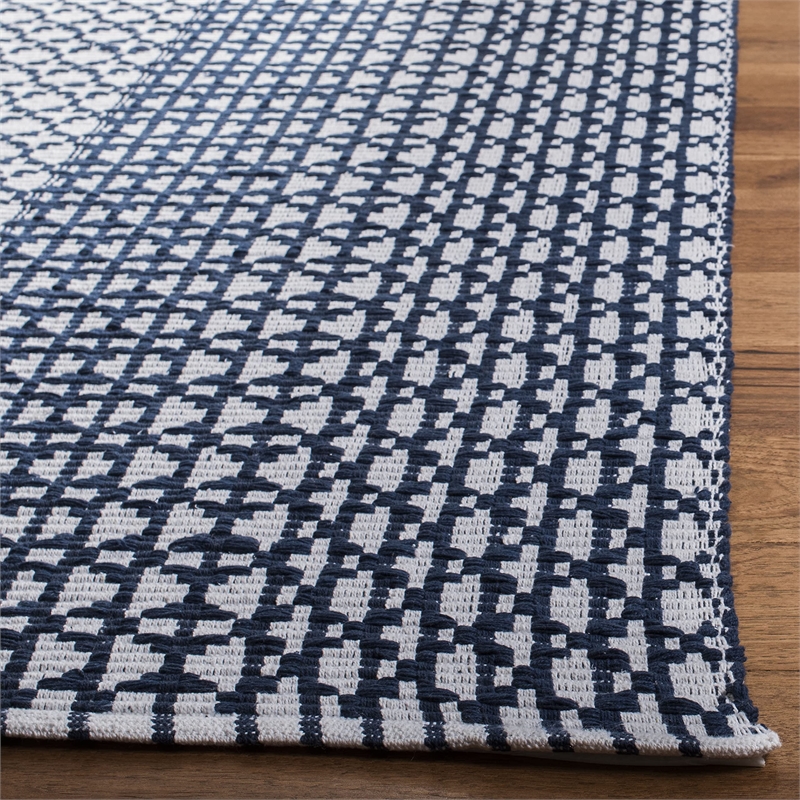 Safavieh Montauk 5' x 8' Hand Woven Rug in Navy and Ivory