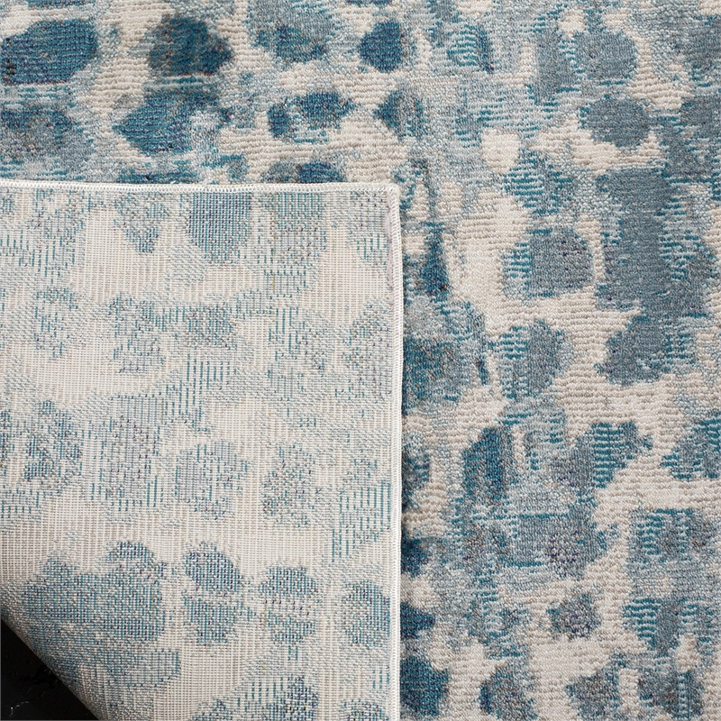 Safavieh Aria 9' x 12' Rug in Ivory and Teal