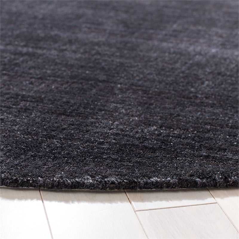 Safavieh Himalaya 6' Round Hand Tufted Wool Rug in Black