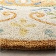 Safavieh Novelty 4' Round Hand Tufted Wool Rug in Gold and Ivory