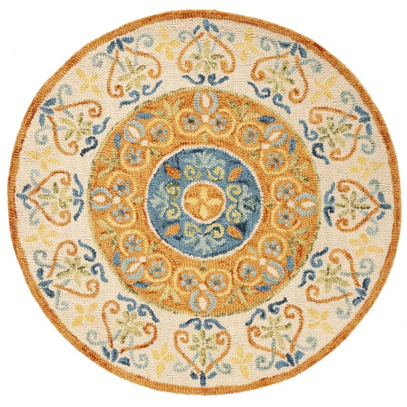 Safavieh Novelty 4' Round Hand Tufted Wool Rug in Gold and Ivory