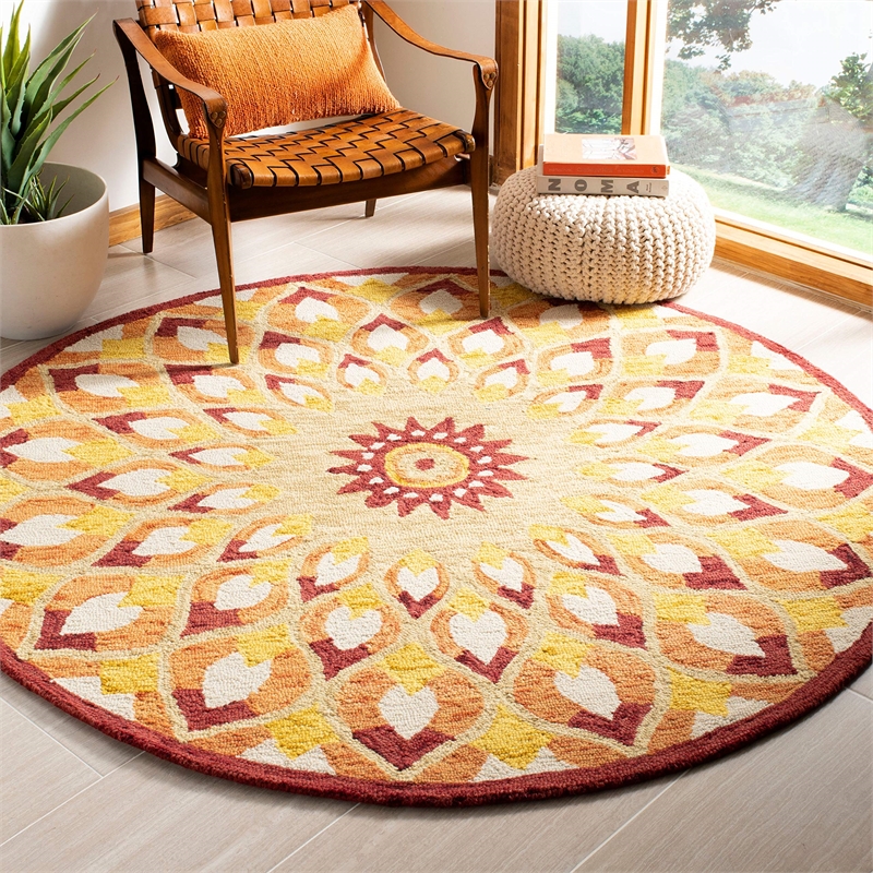 Safavieh Novelty 4' Round Hand Tufted Wool Rug in Rust and Gold