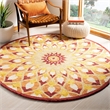 Safavieh Novelty 4' Round Hand Tufted Wool Rug in Rust and Gold