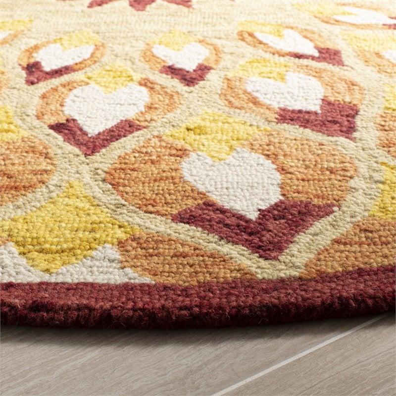Safavieh Novelty 6' Round Hand Tufted Wool Rug in Rust and Gold