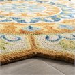 Safavieh Novelty 5' Round Hand Tufted Wool Rug in Gold and Ivory