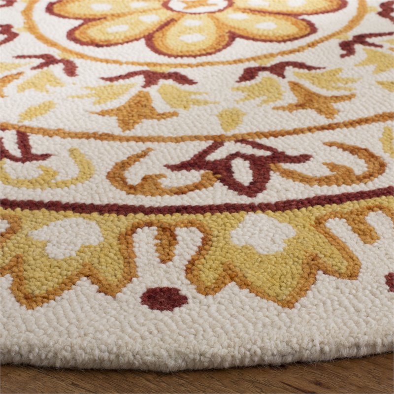 Safavieh Novelty 4' Round Hand Tufted Wool Rug in Ivory and Gold