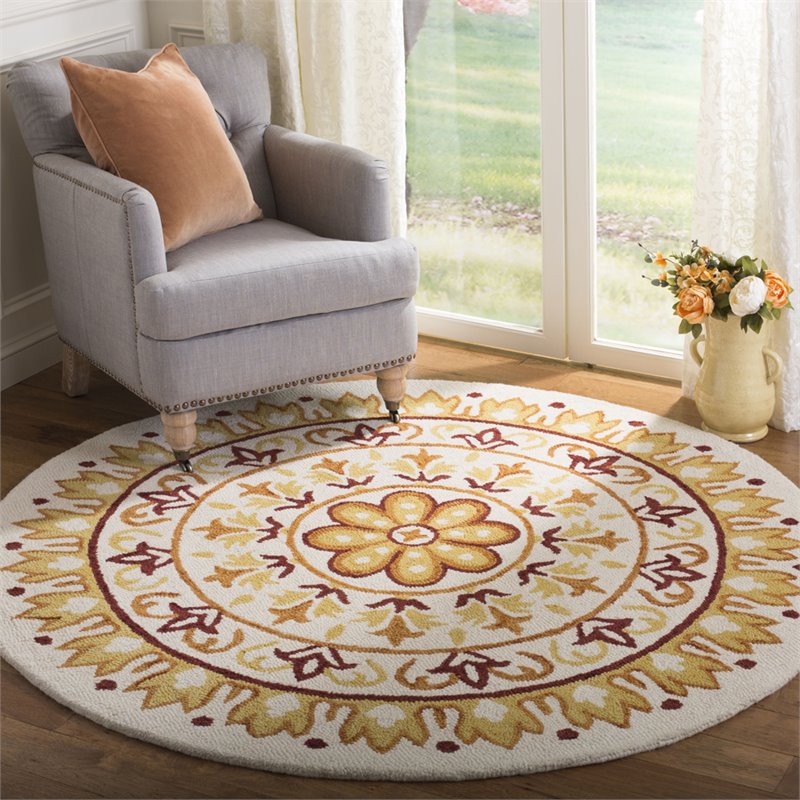 Safavieh Novelty 6' Round Hand Tufted Wool Rug in Ivory and Gold
