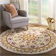 Safavieh Novelty 6' Round Hand Tufted Wool Rug in Ivory and Gold