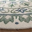 Safavieh Novelty 4' Round Hand Tufted Wool Rug in Ivory and Teal