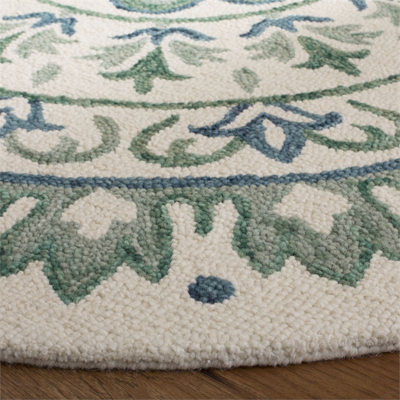 Safavieh Novelty 5' Round Hand Tufted Wool Rug in Ivory and Teal