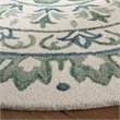 Safavieh Novelty 6' Round Hand Tufted Wool Rug in Ivory and Teal