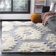 Safavieh Kenya 9' x 12' Hand Woven Shag Wool Rug in Navy and Ivory