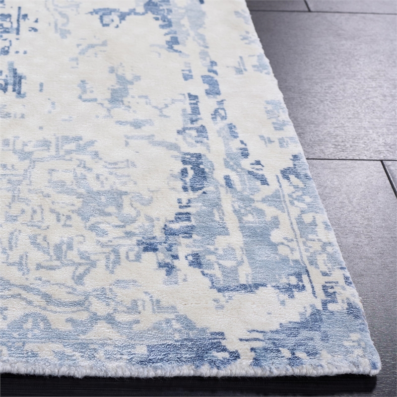 Safavieh Mirage 9' x 12' Hand Loomed Wool Rug in Ivory and Blue