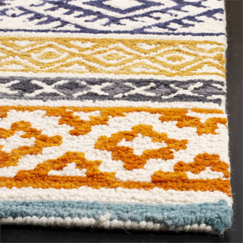 Safavieh Micro-Loop 8' x 10' Hand Tufted Wool Rug in Ivory and Rust