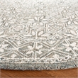 Safavieh Micro-Loop 5' x 8' Hand Tufted Wool Rug in Silver and Ivory