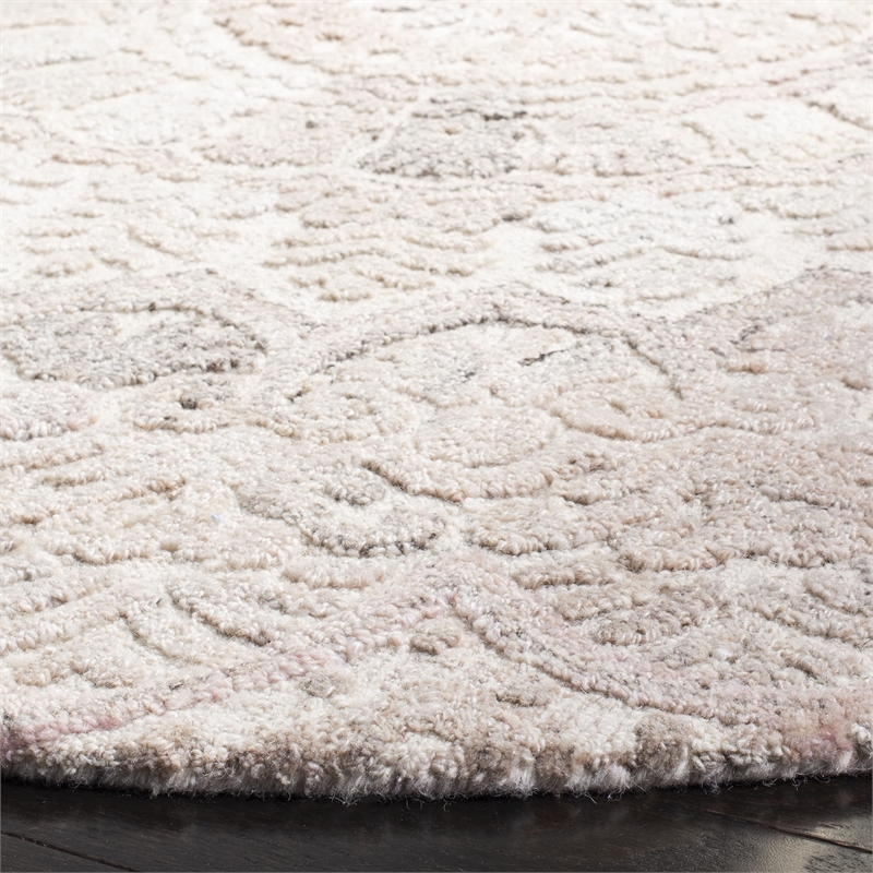 Safavieh Marquee 6' Round Hand Tufted Wool Rug in Beige and Ivory