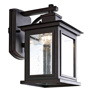 Safavieh Gorgen 6.7&quot Metal and Glass Outdoor Wall Sconce in Bronze