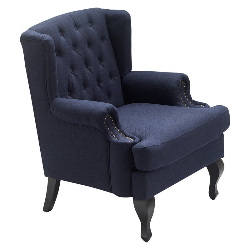 blue tufted armchair