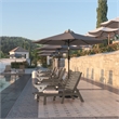 Flash Furniture Newport Plastic Outdoor Lounge Chair with Cup Holder in Brown