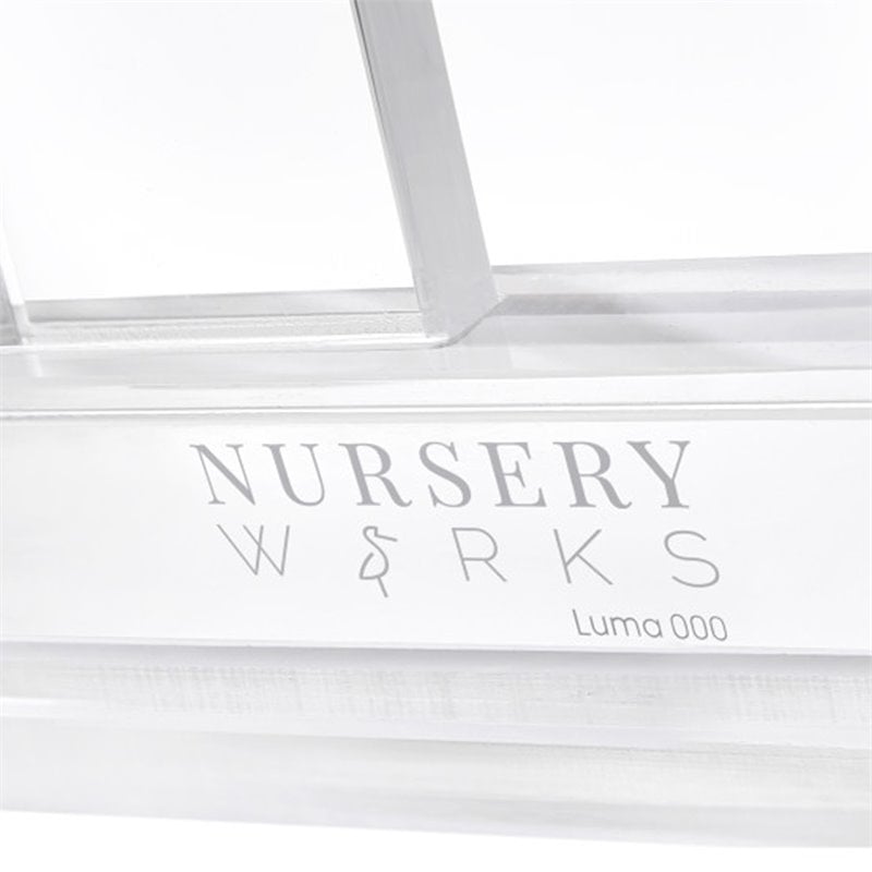 Nursery Works Luma Crib in Acrylic with Rose Gold