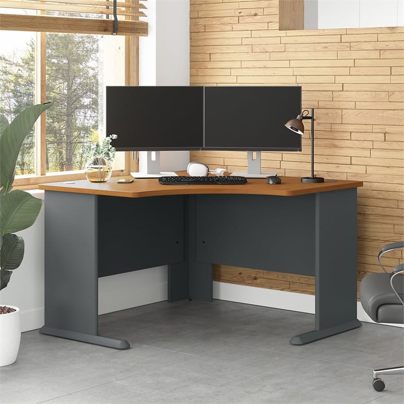 corner office desk setup with a long wooden desk and leather
