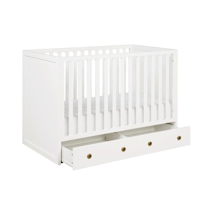 white crib with storage
