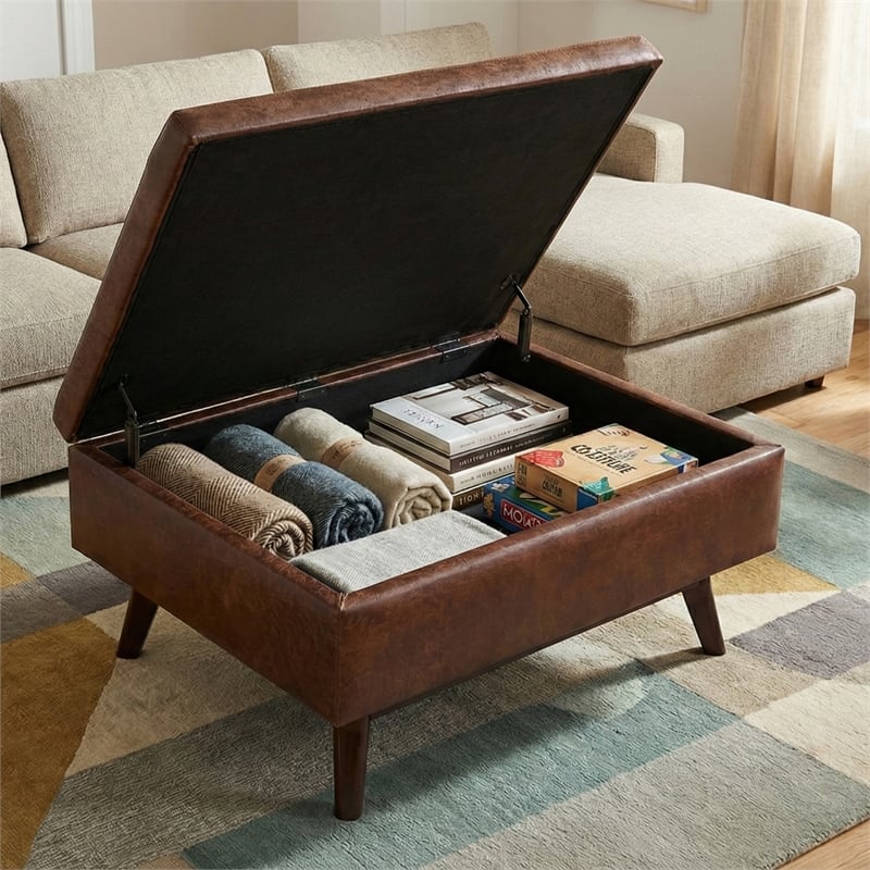 Simpli Home Owen Faux Leather Storage Coffee Table Ottoman in Saddle Brown