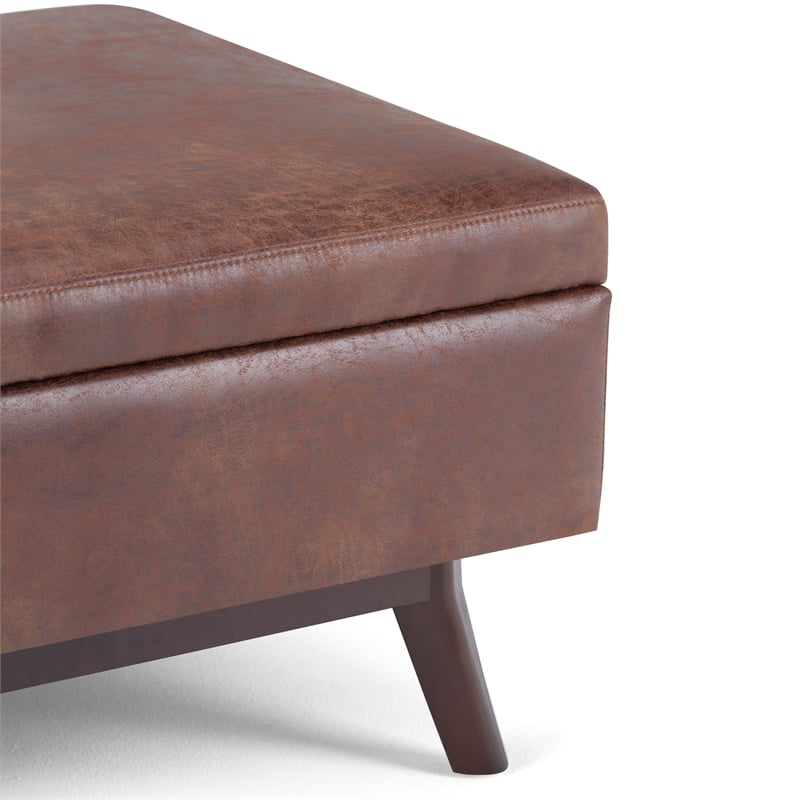 Simpli Home Owen Faux Leather Storage Coffee Table Ottoman in Saddle Brown