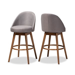 baxton studio carra gray upholstered swivel bar stool in walnut - set of 2