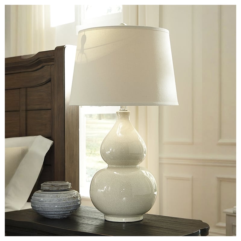 Signature Design by Ashley Saffi Ceramic Table Lamp in Cream