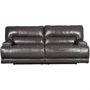 ashley mccaskill faux leather reclining sofa in gray
