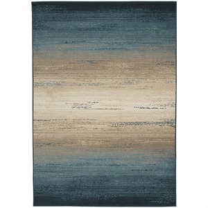 ashley ignacio area rug in blue and tan