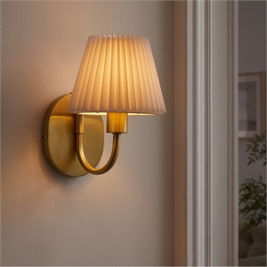 wave wall sconce in brass
