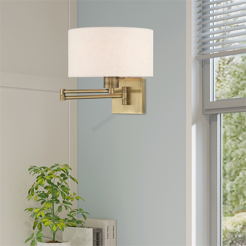 Livex Lighting 1-Light Swing Arm Modern Metal Wall Lamp in Antique Brass/Oatmeal