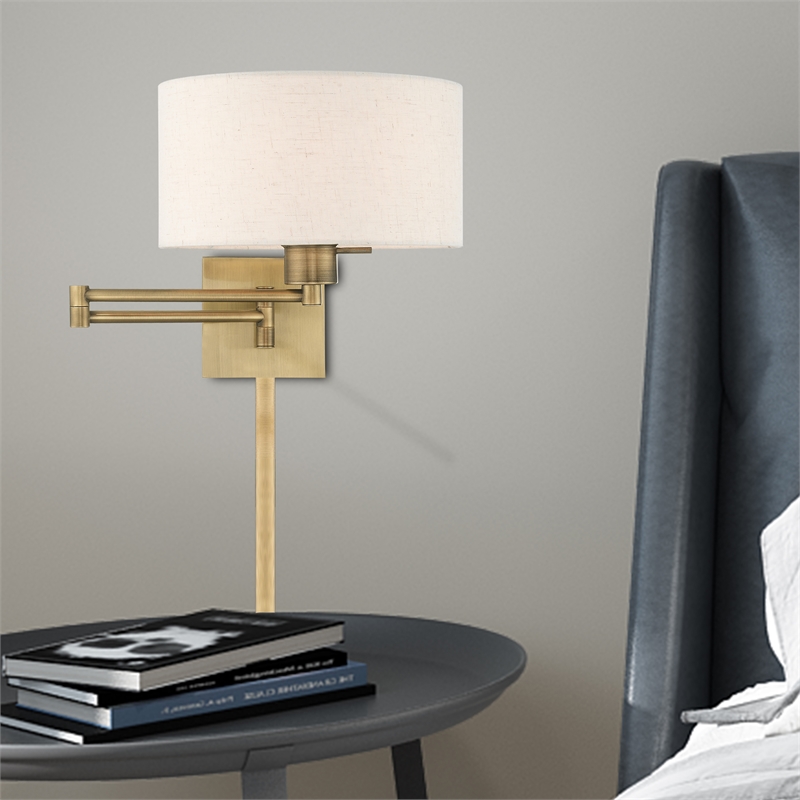 Livex Lighting 1-Light Swing Arm Modern Metal Wall Lamp in Antique Brass/Oatmeal