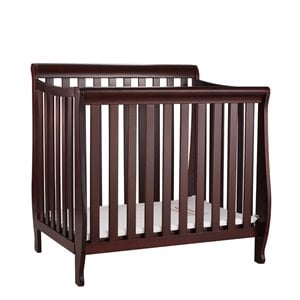 athena alice mini crib with mattress pad in cherry