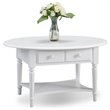 Bowery Hill Oval 1 Drawer Coffee Table with Shelf in Orchid White